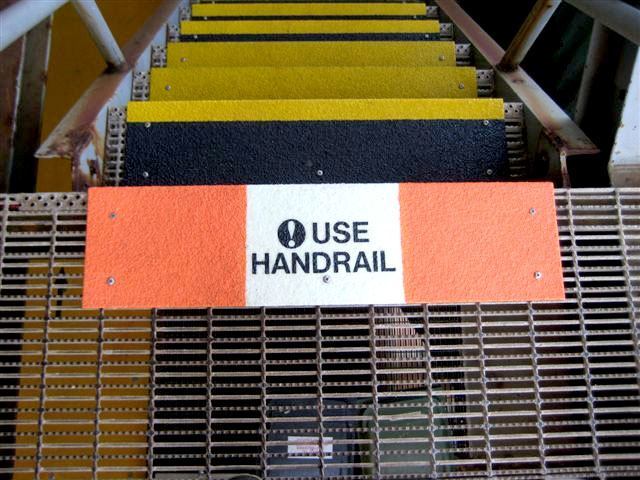Safeguard step covers with 'Use Handrail' markings