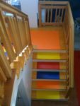 Different colored mats on wooden steps