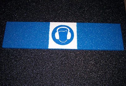 Image of glow-in-the-dark safety symbols on Safeguard anti-slip cover.