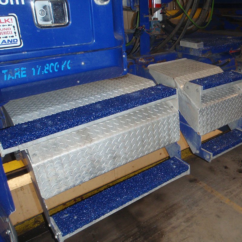 anti slip step covers used on a work vehicle