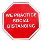 Stop Sign look-a-like that reads "We Practice Social Distancing"