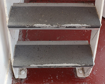 Steps with old anti-slip cover that is worn off