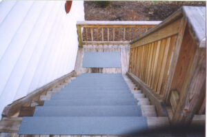anti-slip step covers installed over pressure treated lumber for a law office.