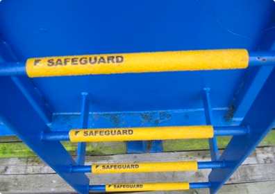 Yellow Anti-Slip Rung Ladder Covers on blue metal ladder
