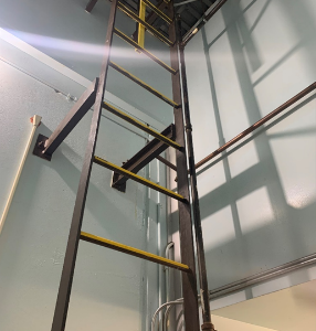 Yellow Anti-Slip Ladder rungs on metal ladder