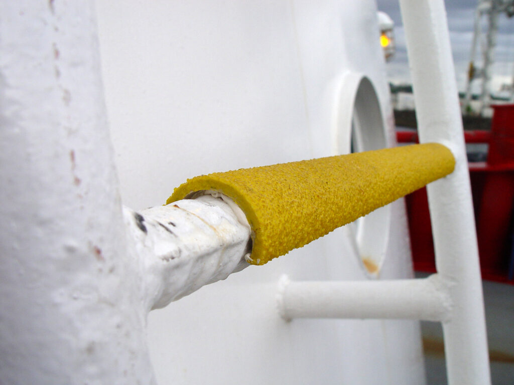 Yellow anti-slip Rung ladder cover on white ladder