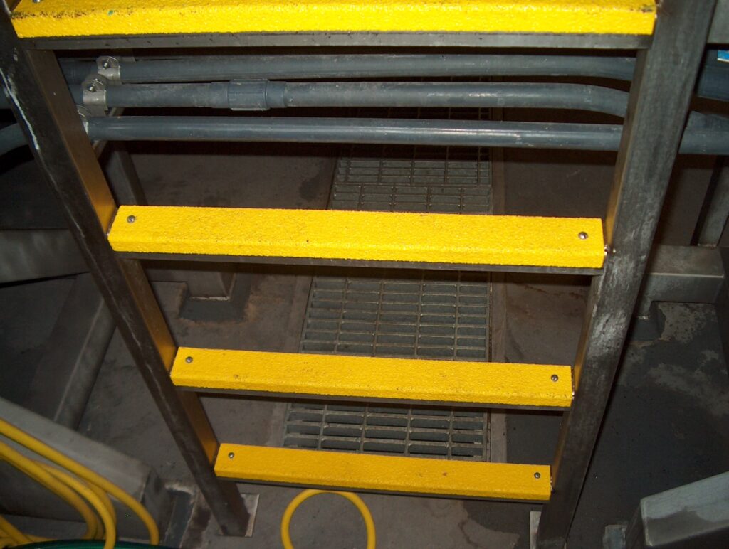Yellow Anti slip covers on metal ladder