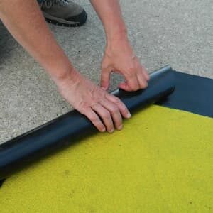 Yellow Anti-slip Roll traction being installed